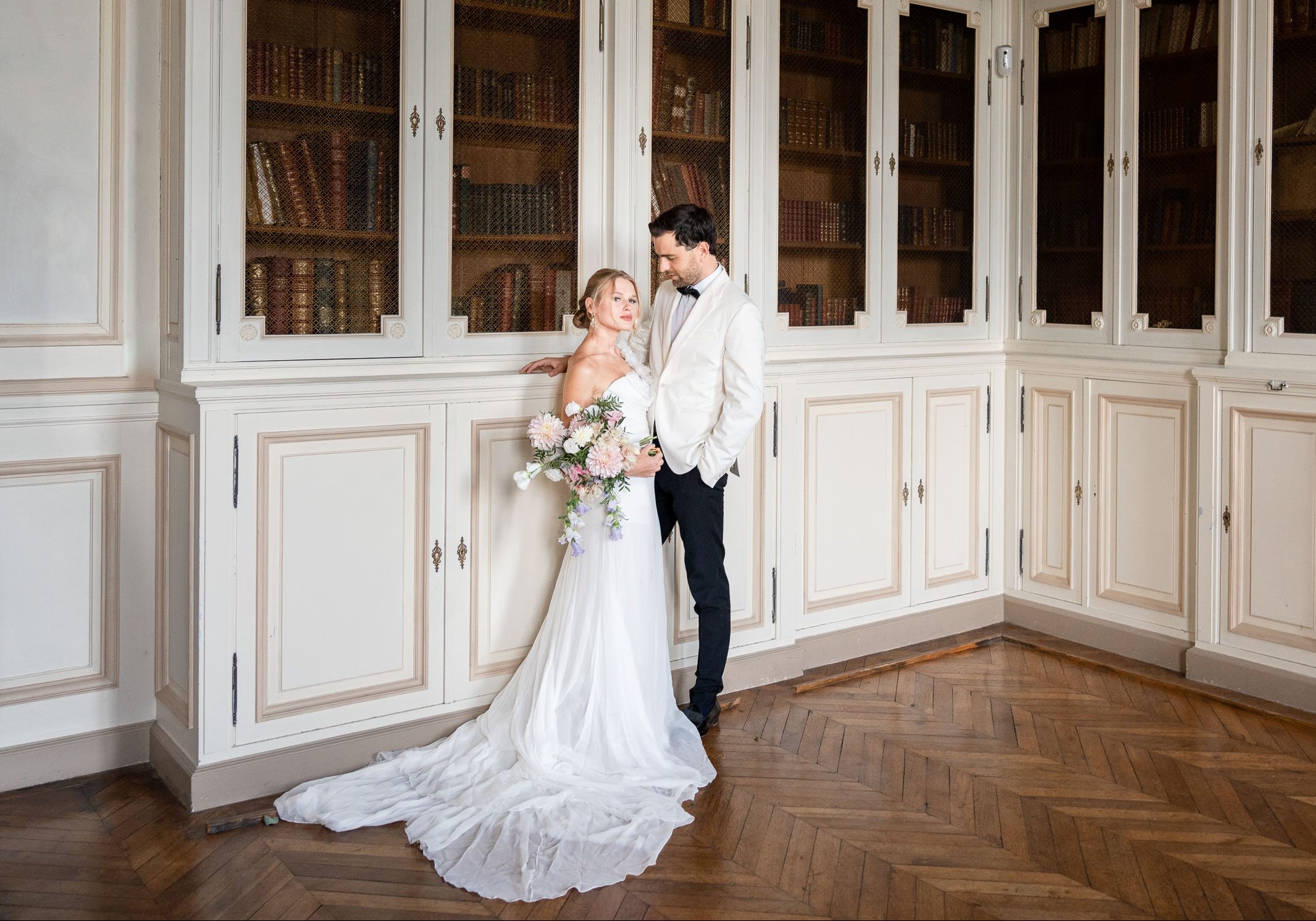 bride and groom in the library by Lake of the Ozarks wedding photographer The Bennetts