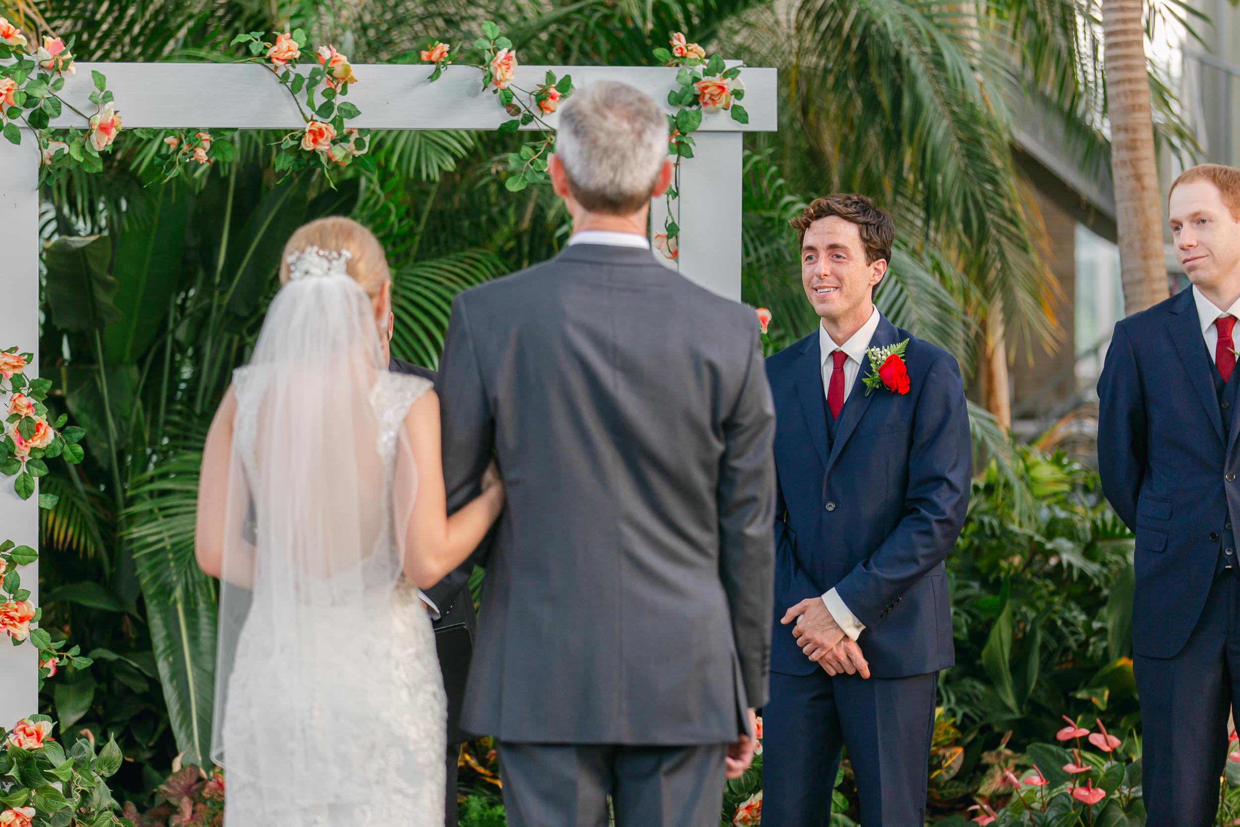 a man in a suit and a woman in a white dress