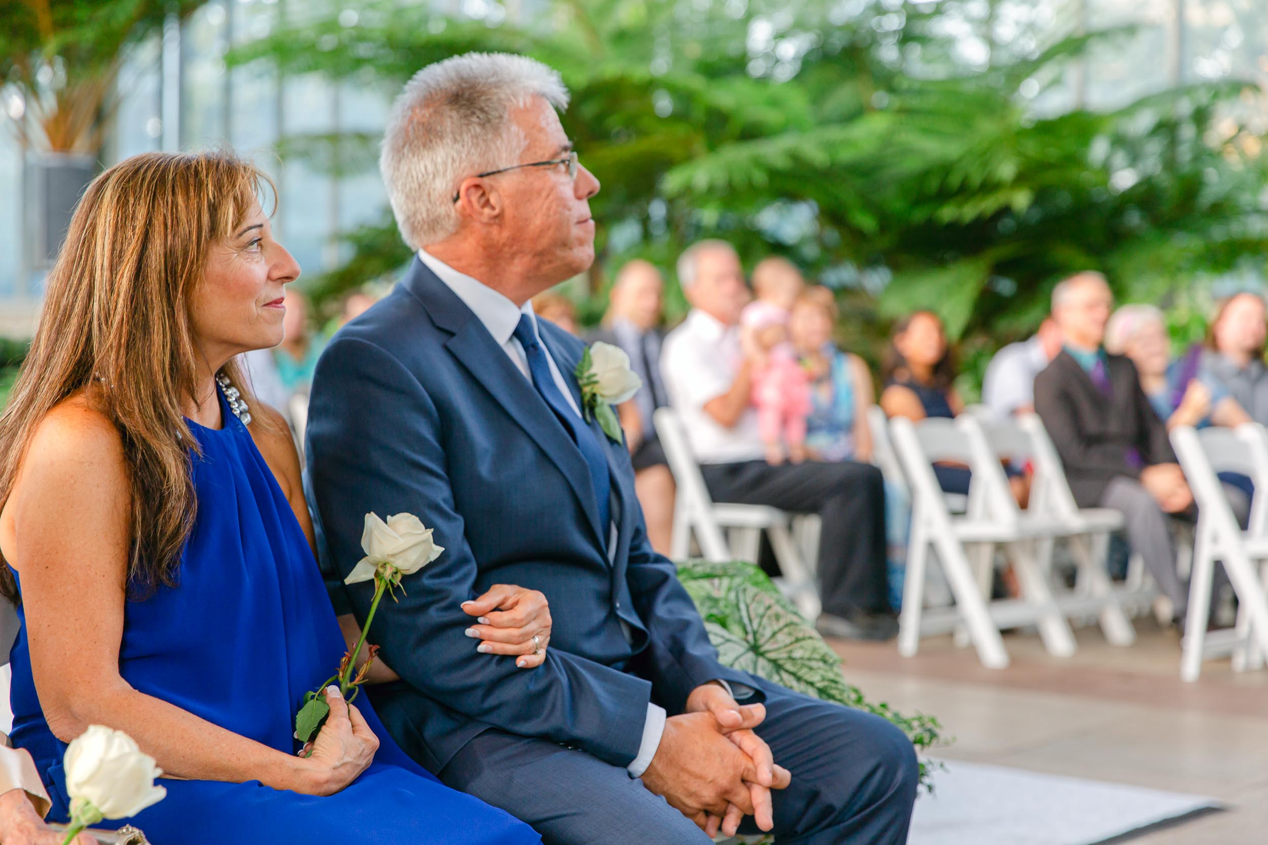 a man and woman sitting on a bench